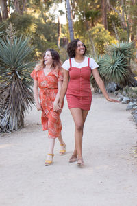 Full length of a smiling young woman