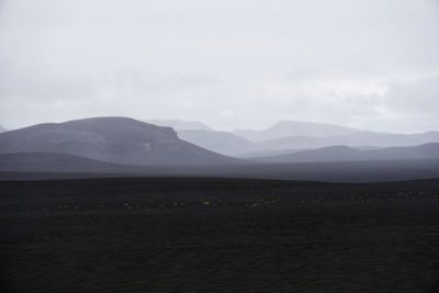 Scenic view of landscape and mountains against sky