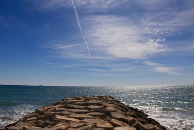 Scenic view of sea against blue sky