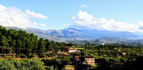 Scenic view of landscape and mountains against sky