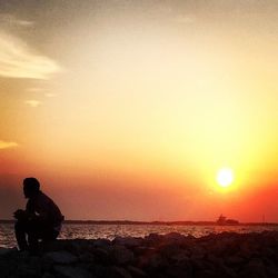 Scenic view of sea at sunset