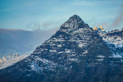 Scenic view of snowcapped mountain against sky