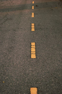 High angle view of arrow symbol on road