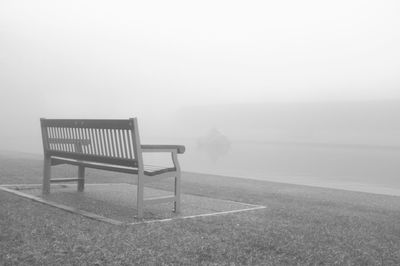 Empty bench at seaside