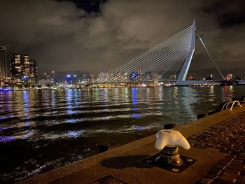 Rotterdam cityscape against sky by night 