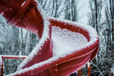 Close-up of ice cream cone against trees