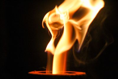 Close-up of fire in darkroom