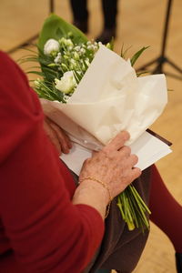 Midsection of woman holding gift box