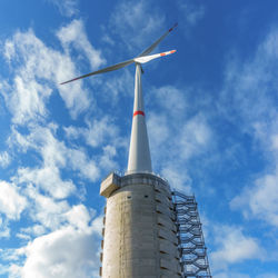 Low angle view of windmill against sky