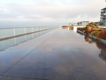 Canal by sea against sky