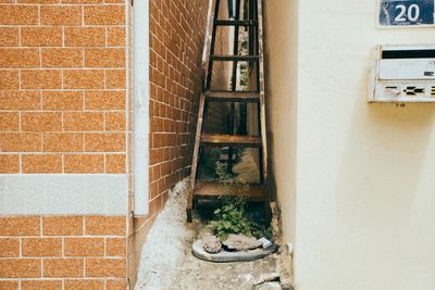 Ladder amidst buildings