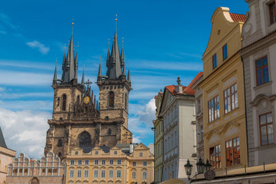 Low angle view of buildings in city against sky