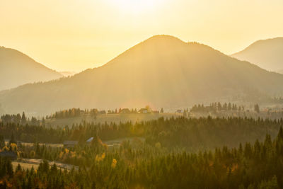 Scenic view of mountains against sky during sunset