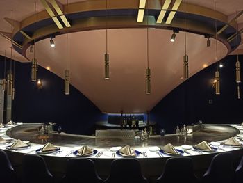 Empty chairs and tables in restaurant