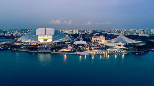 Scenic view of cityscape against blue sky