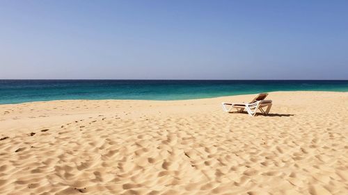 Scenic view of beach against clear sky