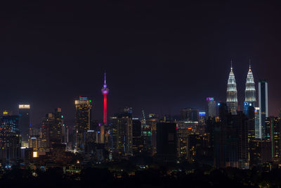 Illuminated buildings in city at night