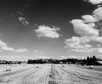 Panoramic view of agricultural field against sky