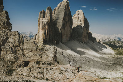 Rock formations on landscape against sky