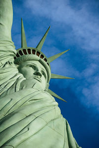 Low angle view of statue against cloudy sky