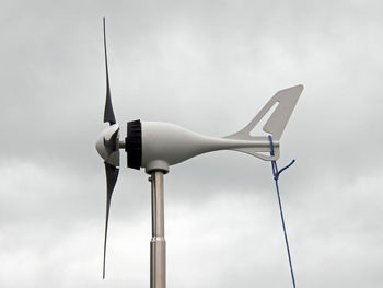 Low angle view of wind turbine against sky