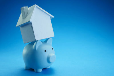 Close-up of stuffed toy against blue background