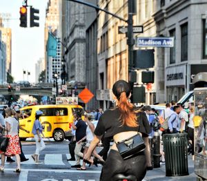 Group of people crossing road in city