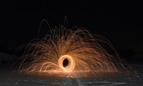 Light painting against sky at night