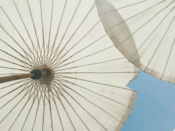 Low angle view of umbrella against sky