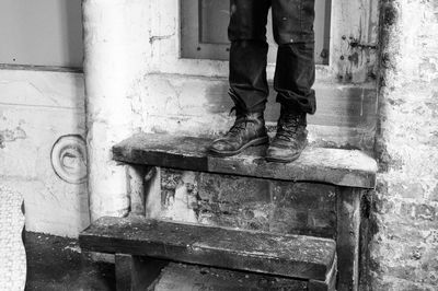 Low section of man standing on floor