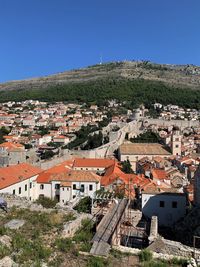 High angle view of townscape against clear blue sky