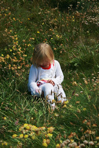 Girl sitting on field