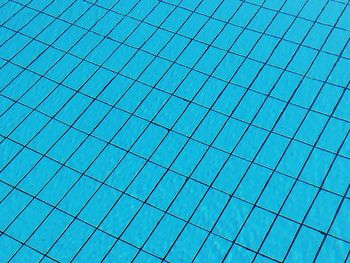 Low angle view of swimming pool against clear blue sky