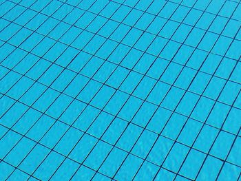 Low angle view of swimming pool against clear blue sky