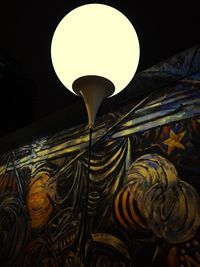 Low angle view of illuminated lamp