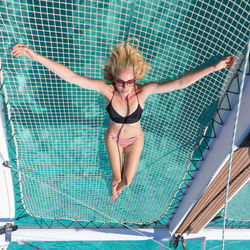 Full length of young woman in swimming pool