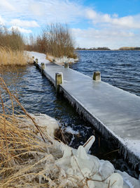 Scenic view of sea against sky during winter