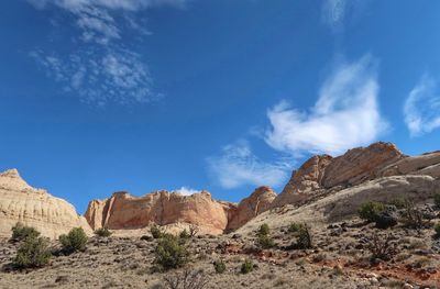 Scenic view of mountain against blue sky