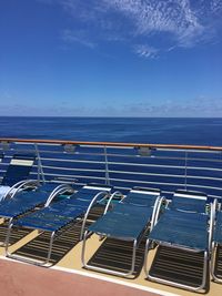 High angle view of swimming pool by sea against blue sky