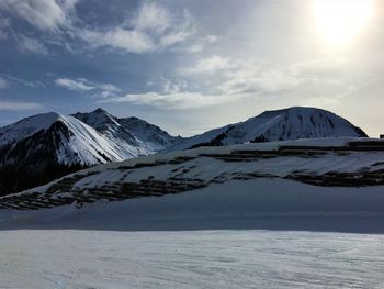 Scenic view of snowcapped mountains against sky