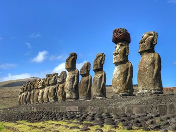 Moai standing against the sky