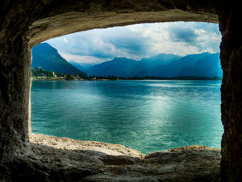 Scenic view of sea against cloudy sky