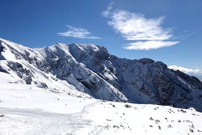 Scenic view of snowcapped mountains against sky