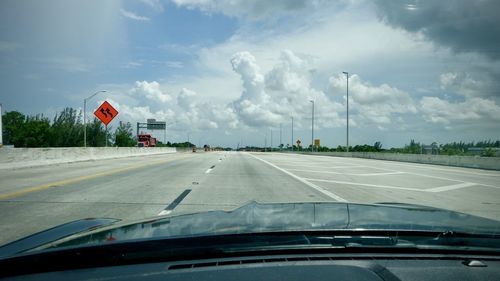 Road seen through car windshield