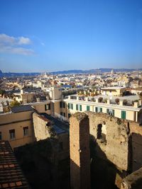 High angle shot of townscape against blue sky