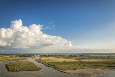 High angle view of landscape at walls of mont saint michel against cloudy sky