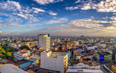 High angle view of city buildings against sky