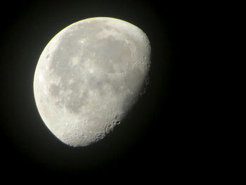 Low angle view of moon against clear sky at night