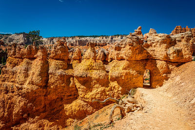 Rock formations against blue sky