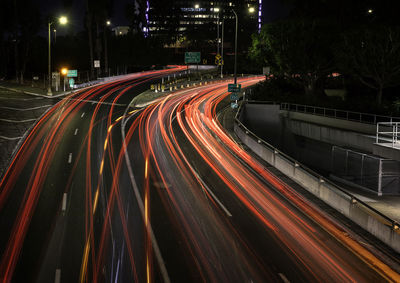 High angle view of light trails on road at night